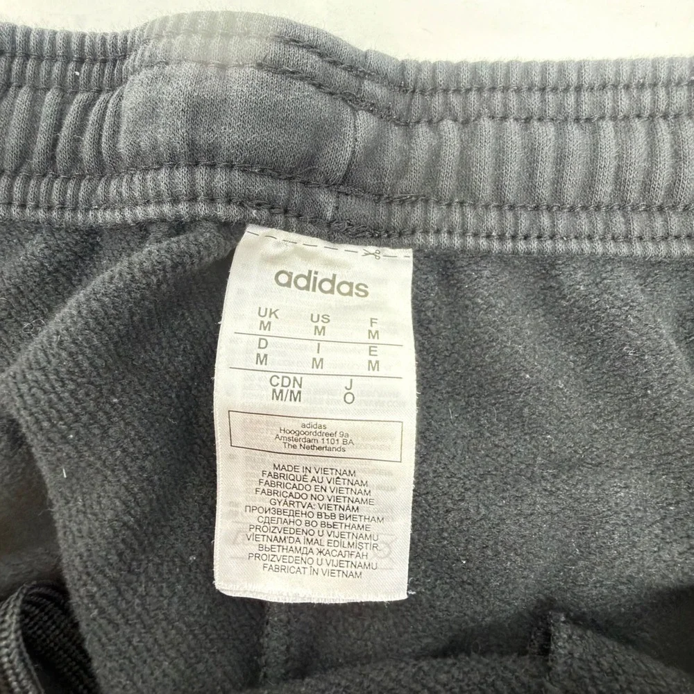 Adidas Men M Black Fleece Joggers Tapered Sweatpants 3 Stripe Spell Out GT9435